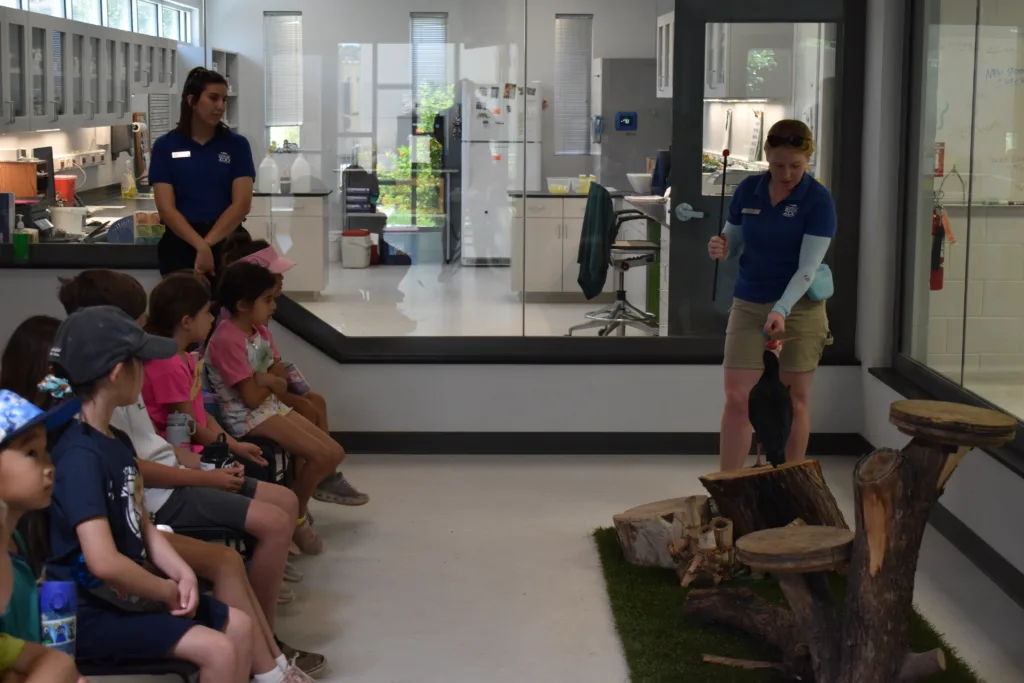 Zoo Educator and ambassador animal with group