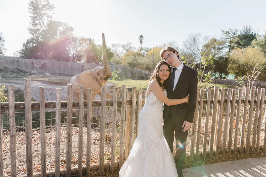 Couple with elephant closer